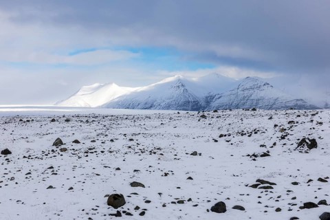 Lava rock field, mountain range, snow, winter, Vatnajökull region, Iceland, Scandinavia