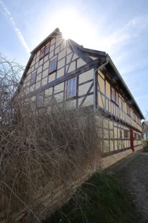 Rectory of St. Stephen in backlight, half-timbered house, Bad Langensalza, Thuringia, Germany