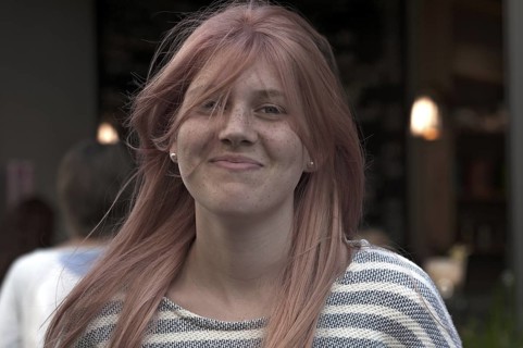 Smiling girl with freckles and waving hair, teenager, Freiburg, Baden-Württemberg, Germany