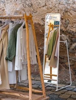Fashionable women's wardrobe on a clothes rack in front of the entrance to a boutique, Soller,