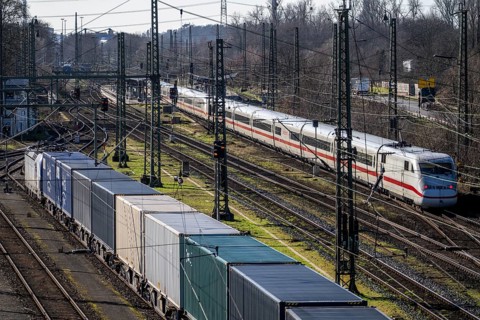 ICE long-distance train, on the line, container trains in the freight yard, so-called installation