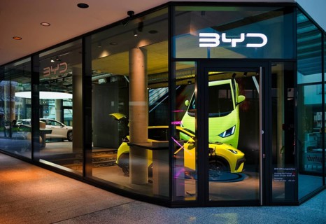 View through shop window at showroom, sales exhibition of the car brand BYD Build Your Dreams,