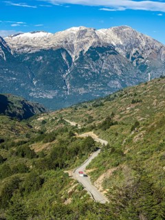 Road Carretera Austral south of Cochrane, mountain pass, driving bus, Patagonia, Chile