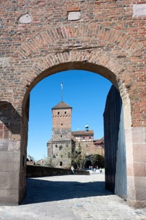 View through an archway to the Heidenturm der Kaiserburg in the old town of Nuremberg, Middle