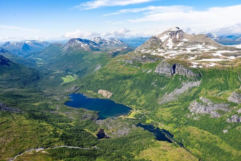 View from the summit of Innerdalstårnet of mountainous landscape, Innerdalen high valley and lake