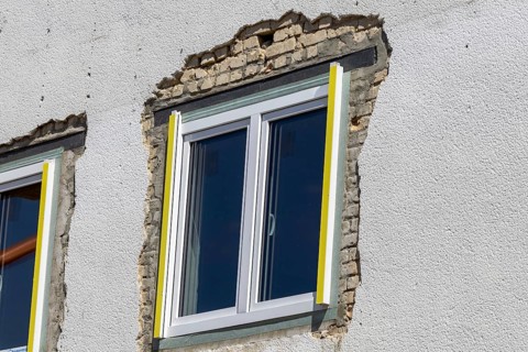 Newly installed window in an old building