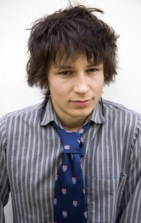 Model released head and shoulders portrait of teenage wearing shirt and tie, UK