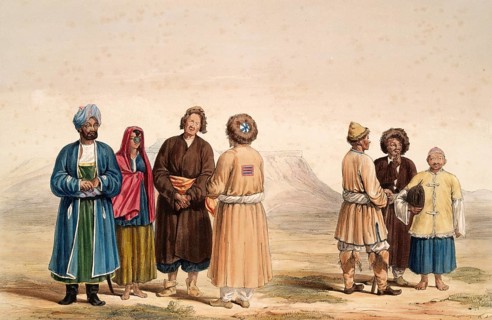 Several people in traditional clothing stand in a wide landscape