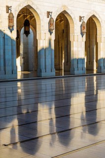 Arched gates with brass lights at the Sultan Qaboos Mosque, Muscat, Arabian Peninsula, Sultanate of