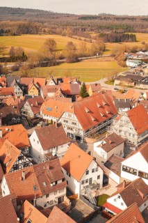 View of a charming city center with historic half-timbered houses and red roofs, Ötisheim,