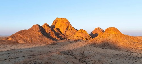 Aerial view, sunset, mountains in the desert, Spitzkoppe summit, Namib desert, Namibia