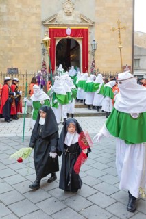 Little girls dressed like a nun leading Good Friday Procession, Enna, Siclly, Italy