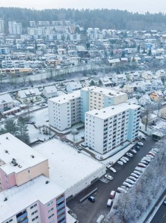Bird's eye view of blocks of flats in a snowy town, Nagold, Black Forest, Germany