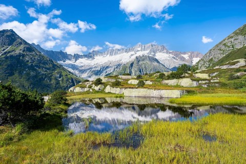 Picturesque mountain landscape, dammastock and damma glaciers reflected in Moorsee, Göscheneralp,