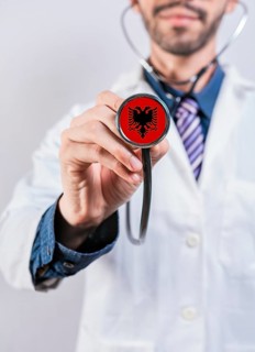 Albania health and medical insurance concept. Albania healthcare system, doctor holding stethoscope