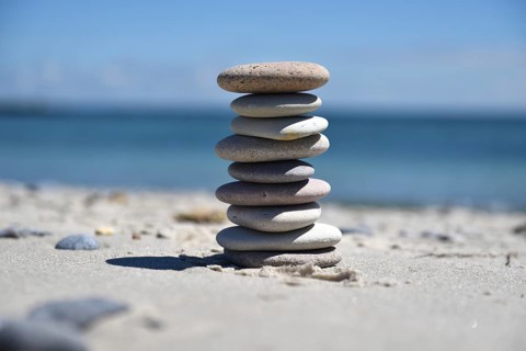 Stone pile on the sandy beach of the offshore island of Heligoland, Schleswig-Holstein, Germany