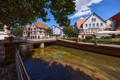 Erbacher brewhouse, restaurant, river Mümling, car and pedestrian bridge, metal railings, trees,