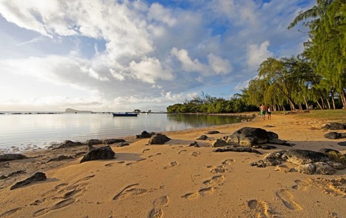 Golden sandy beach on the Indian Ocean near Calodyne, with Gunner's Coin Island in the background,