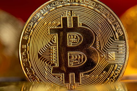 Close-up of symbolic bitcoins