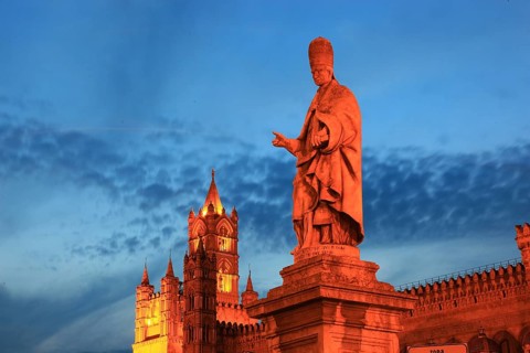 In the old town of Palermo, statue of the saint in front of the Cathedral Maria Santissima Assunta,