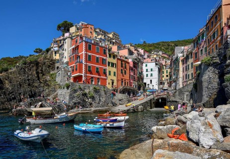 Fishing boats in the harbour of Riomaggiore, village view, Cinque Terre, province of La Spezia,
