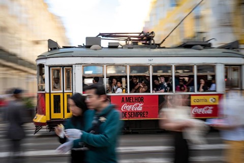 LISBON, PORTUGAL - MAY 19, 2025: Famous tram number 28 at the street of the city. Photo taken using