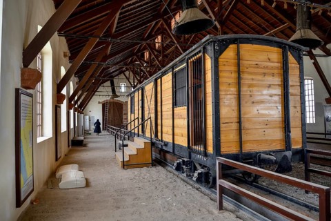 Historic carriage of the Hejaz Railway in a renovated station building of Hegra, Mada'a in Salih,