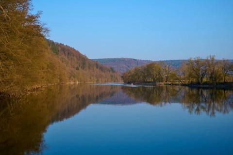 Extensive river landscape with banks lined with forests and clear skies, Boxtal, Main-Boxtal,