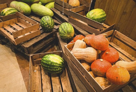 Watermelons and pumpkins, in a wooden box, on pallets, supermarket, lifestyle, no people, mobile