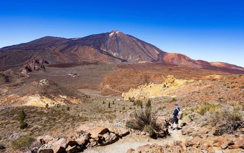 Mountain hiking, hikers on the way to Montana Guajara, Canada del Capricho rock formation with view