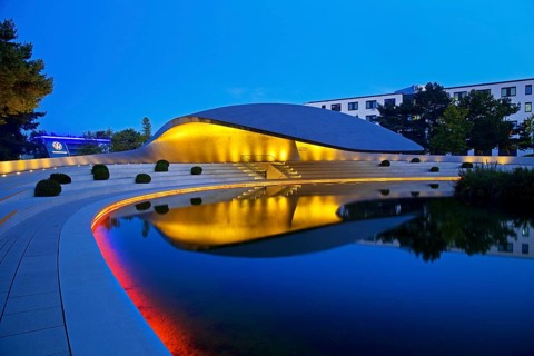 Illuminated Porsche Pavilion in the evening, Autostadt, Volkswagen AG, Wolfsburg, Lower Saxony,