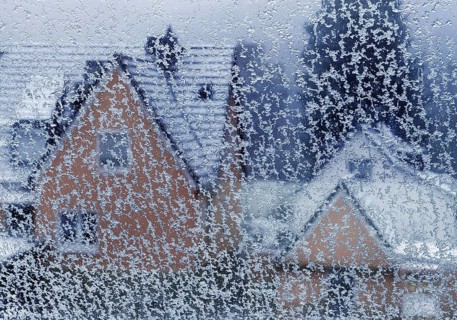 Ice on a window pane with indistinct view of a house in winter, Witten, North Rhine-Westphalia,