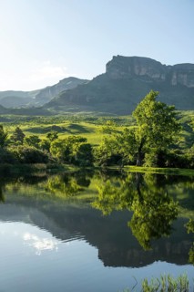 Amphitheatre with reflection in the lake, Royal Natal National Park, Drakensberg Mountains south,