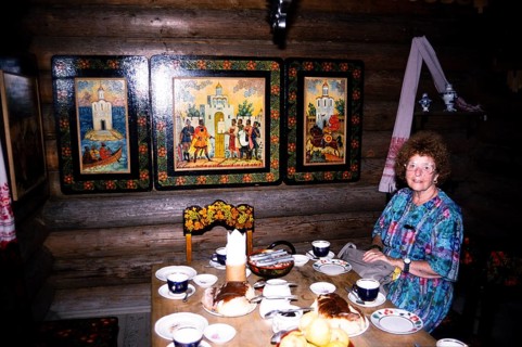 In the tea house café of the Dagomys Tea Plantation, Sochi, Russia woman sitting at a laid table