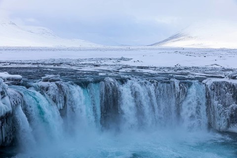 Godafoss waterfall, icy and snowy rock face, snowy landscape, Northern Iceland Eyestra, Iceland