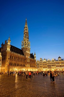 BRUSSELS, BELGIUM, MAY 31, 2018: Grote Markt (Grand Place) square crowded with tourists illuminated