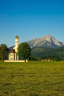 Baroque church of St Coloman, behind it the Tannheim mountains, Schwangau, Ostallgaeu, Allgaeu,
