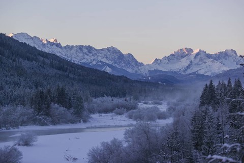 Isar valley in winter at temperatures of minus 18 degrees Celsius. Snow covered landscape with the