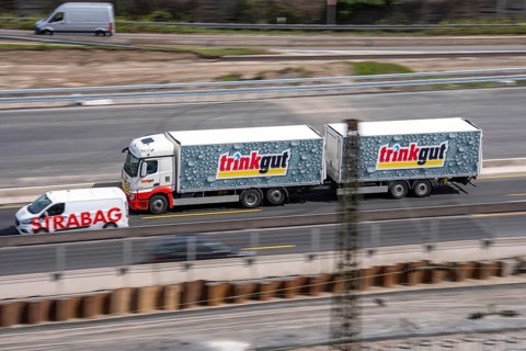 Freight truck for food logistics, on the highway, beverage market chain Trinkgut