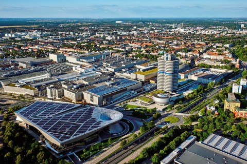 MUNICH, GERMANY, JULY 08, 2018: Aerial view of BMW Museum and BWM Welt and factory and Munich from