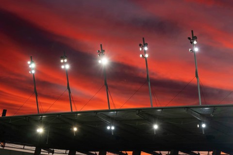 Stadium roof spotlights with a beautiful colorful sky at dusk in Lubin, Poland