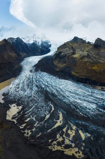 Overhead shot capturing the majestic spread of Vatnajökull Glacier as it carves through mountainous