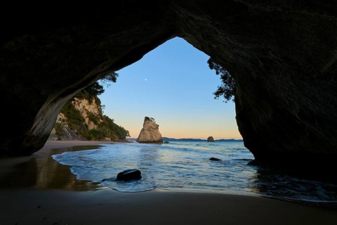 View from a cave onto the calm sea with rock formations, Cathedral Cove, Coromandel, Canterbury,