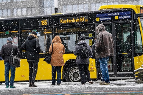 Winter weather, heavy snowfall, passengers waiting for the bus in the snow, at Essen central
