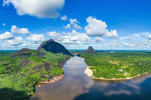 Black river and white sand beach before the granite hills, Cerros de Mavecure, Eastern Colombia