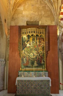 Magnificent altar with a religious medieval painting, framed by sacred architecture, Cathedral