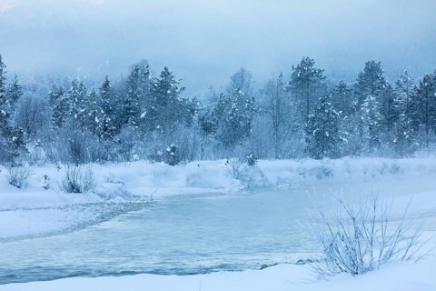 Isar valley in winter at temperatures of minus 18 degrees Celsius. Snow covered landscape with the