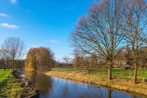 River Dinkel, trees without leaves, blue sky, peaceful rural scene, Heek-Nienborg, Münsterland,