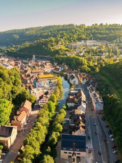 Aerial view of a town along a river, embedded in a hilly, wooded landscape, Calw, Black Forest,