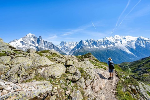 Mountaineers on a hiking trail in front of a mountain landscape, view of mountain peaks Aiguille